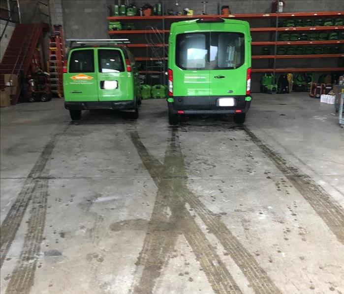 Two vans in warehouse.