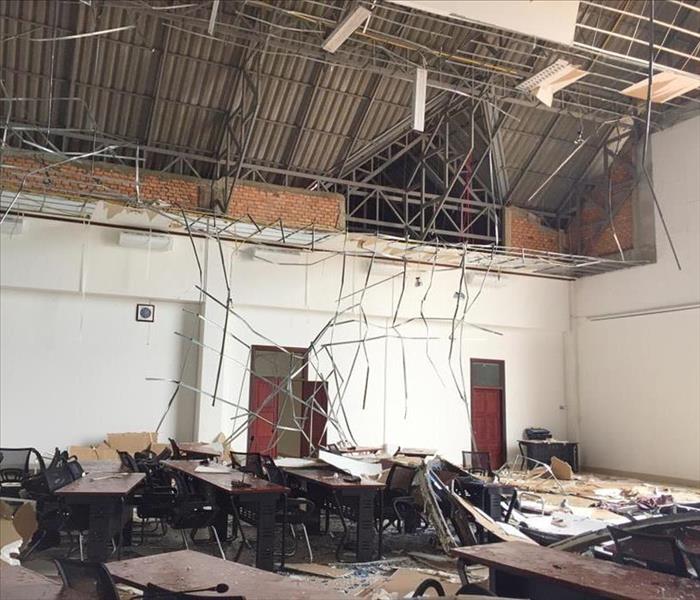 Ceiling collapsed from commercial, debris on the floor